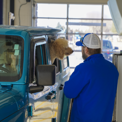 Customer with dog enjoys car wash
